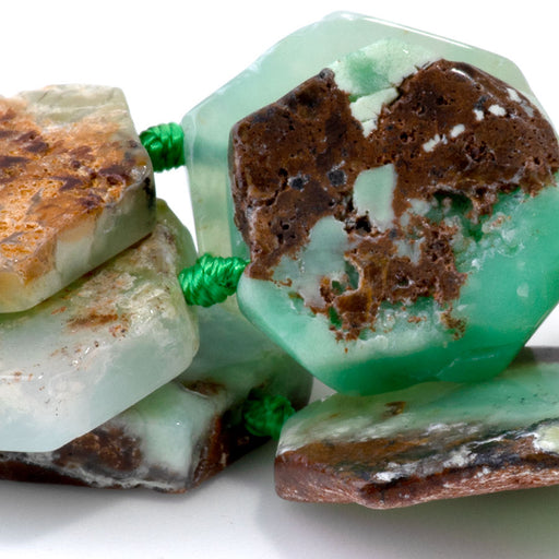 This is a Dakota Stones 12-18mm Australian Chrysoprase Flat Hexagon Gemstone strand with free-form beads in 15-16 inch strand.