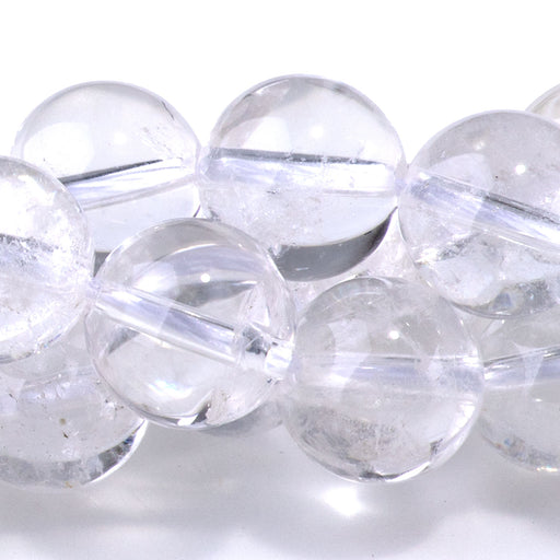 This is a Dakota Stones 10mm Crystal Quartz Gemstone strand with A grade round beads in 15-16 inch strand.