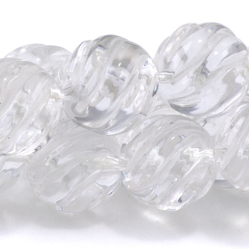 This is a Dakota Stones 12mm Crystal Quartz Carved Gemstone strand with round beads in 15-16 inch strand.