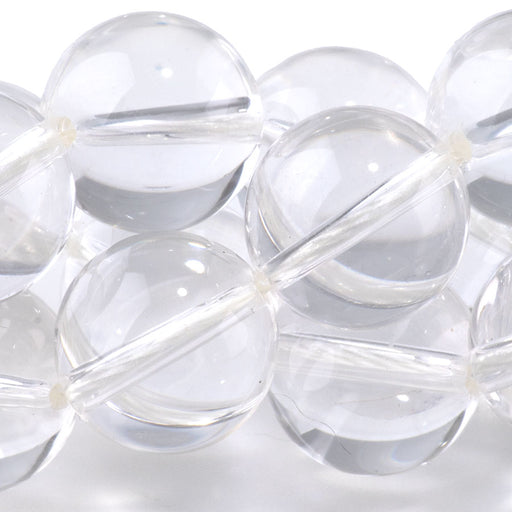 This is a Dakota Stones 15mm Crystal Quartz Gemstone strand with round beads in 15-16 inch strand.