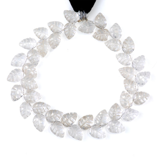 This is a Dakota Stones 8x11mm Crystal Quartz Leaf Gemstone strand of round beads in 8 inch strand.