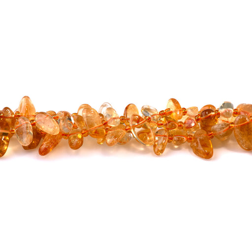 This is a Dakota Stones 6x12-10x20mm Citrine Dancing Drops Gemstone strand with AA grade free-form beads in 15-16 inch strand.