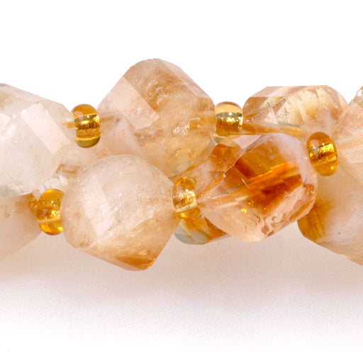 This is a Dakota Stones 7x8mm Citrine Swirl Gemstone strand with faceted oval beads in 15-16 inch strand.