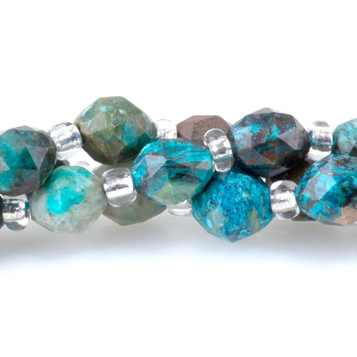 This is a Dakota Stones 4x6mm Chrysocolla Triangle Cut Rice Gemstone strand with faceted beads in 15-16 inch strand.