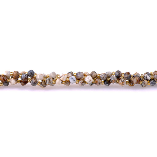 This is a Dakota Stones Mm Dendritic Opal Corner Gemstone strand with table-cut cube beads in 15-16 inch strand.