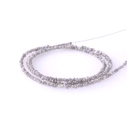 This is a Dakota Stones 2-3mm Grey Diamond Gemstone strand with rough nugget beads in 15-16 inch strand.