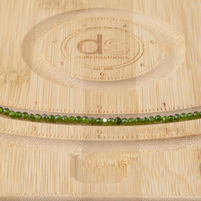 This is a Dakota Stones 3mm Diopside Gemstone strand with AAA grade faceted round beads in 15-16 inch strand.