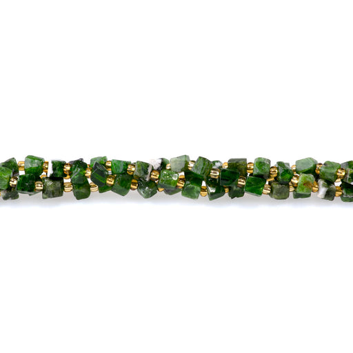 This is a Dakota Stones 4-5mm Diopside Gemstone strand with irregular cube beads in 15-16 inch strand.