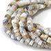 This is a Dakota Stones 6mm Dendritic Opal Large Hole Gemstone strand with faceted hexagon beads in 8 inch strand.