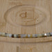 This is a Dakota Stones 6mm Dendritic Opal Large Hole Gemstone strand with faceted hexagon beads in 8 inch strand.