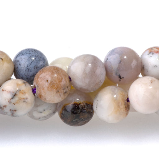This is a Dakota Stones 6mm Purple Dendritic Opal Gemstone strand with round beads in 15-16 inch strand.