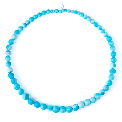 This is a Dakota Stones 7x10-11mm Opal Sky Blue Gemstone strand with dyed irregular round beads in 15-16 inch strand.
