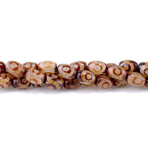 This is a Dakota Stones 10x14mm DZI Agate Brown Eye Gemstone strand with barrel beads in 15-16 inch strand.