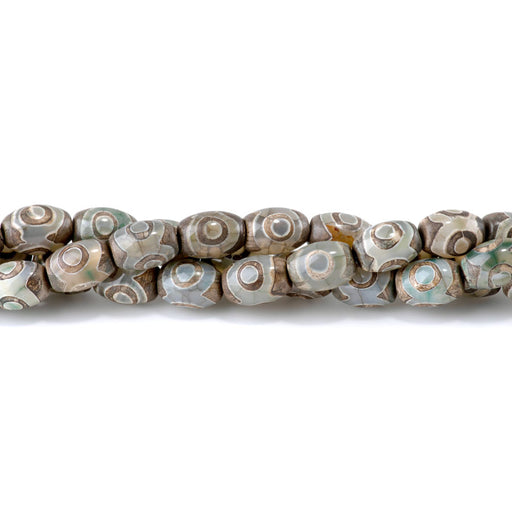 This is a Dakota Stones 10x14mm DZI Agate Green Eye Gemstone strand with barrel beads in 15-16 inch strand.
