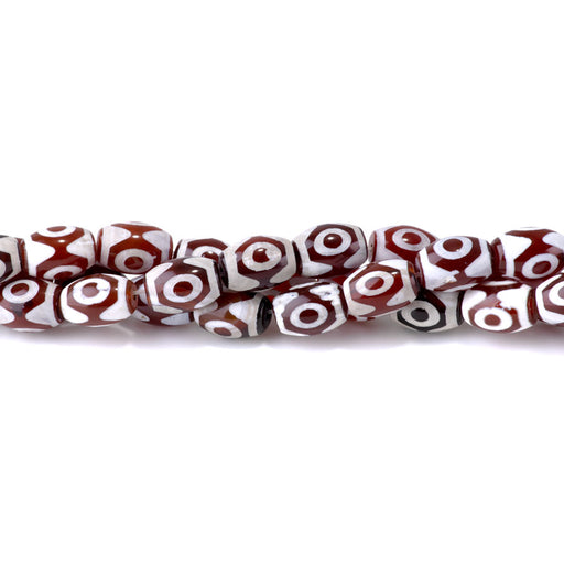 This is a Dakota Stones 10x14mm DZI Agate Red Eye Gemstone strand with barrel beads in 15-16 inch strand.