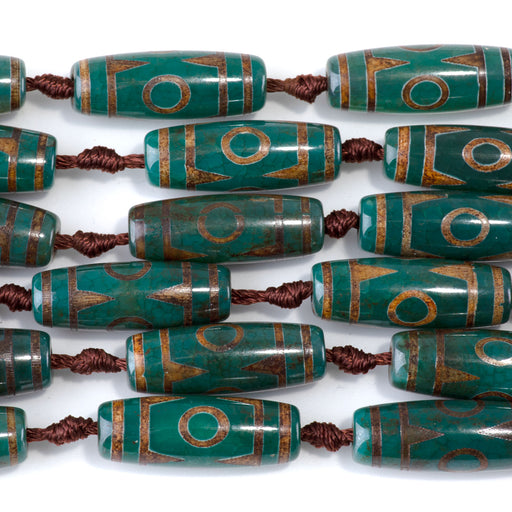 This is a Dakota Stones 10x30mm DZI Agate Three Eye Dark Gemstone strand with barrel beads in 15-16 inch strand.