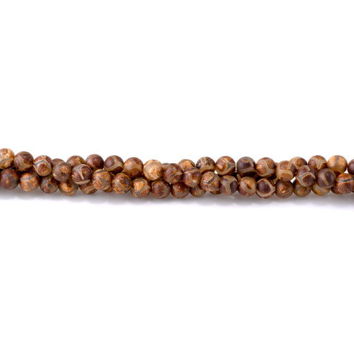 This is a Dakota Stones 6mm DZI Turtle Agate Brown Gemstone strand with round beads in 15-16 inch strand.