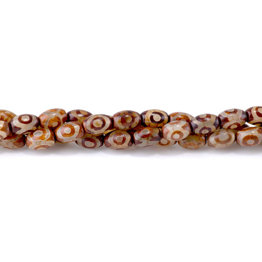 This is a Dakota Stones 8x12mm DZI Agate Brown Eye Gemstone strand with barrel beads in 15-16 inch strand.
