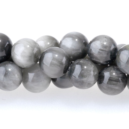 This is a Dakota Stones 6mm Eagle Eye Stone Gemstone strand with round beads in 15-16 inch strand.