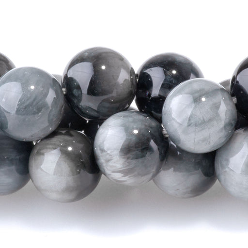 This is a Dakota Stones 8mm Eagle Eye Stone Gemstone strand with round beads in 15-16 inch strand.