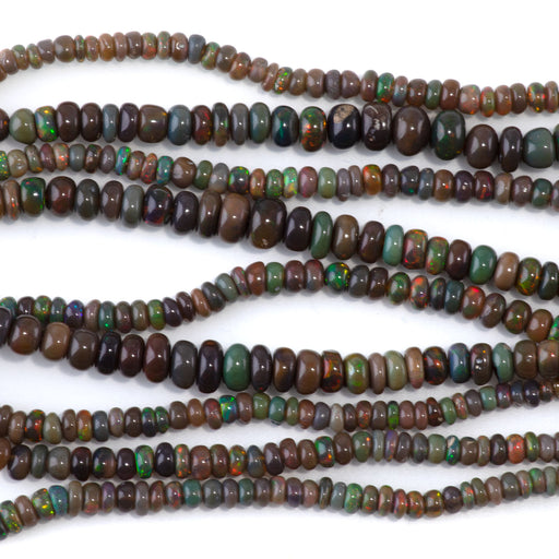 This is a Dakota Stones 5x2-5-4x6mm Ethiopian Opal Gemstone strand with irregular rondelle beads in 18 inch strand.