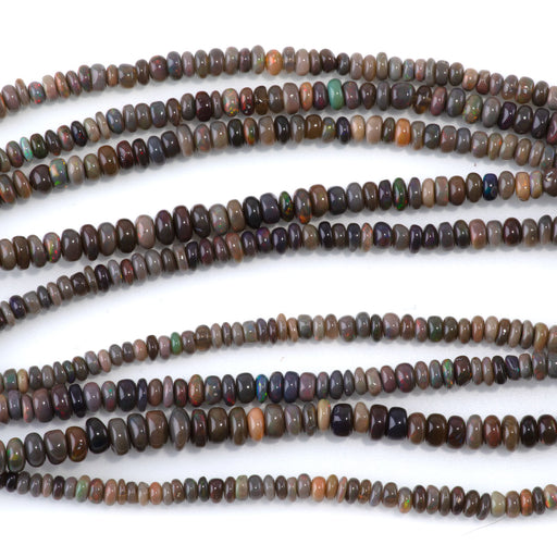 This is a Dakota Stones 1x2-3x5mm Ethiopian Opal Gemstone strand with irregular rondelle beads in 15-16 inch strand.