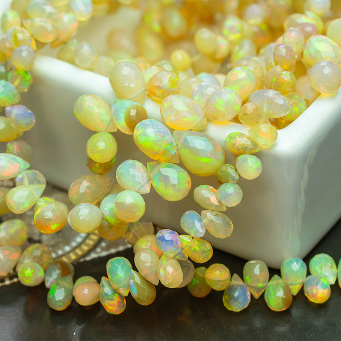 Dark Yellow Ethiopian Opal 3x5-7x10mm Graduated Faceted Drop - 15-16 Inch