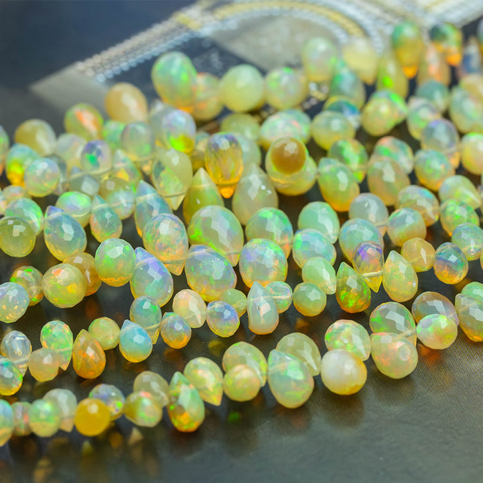 Dark Yellow Ethiopian Opal 3x5-7x10mm Graduated Faceted Drop - 15-16 Inch