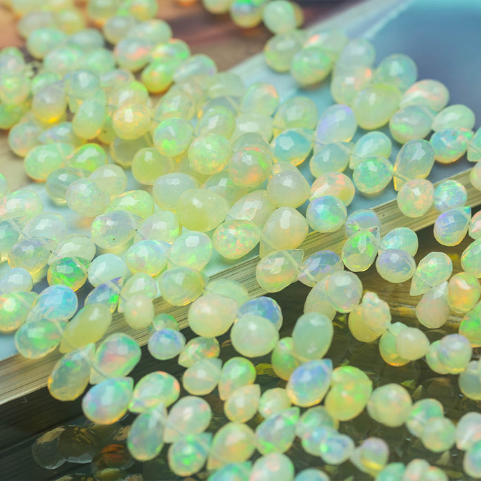 Light Yellow Ethiopian Opal 3x5-7x10mm Graduated Faceted Drop - 15-16 Inch