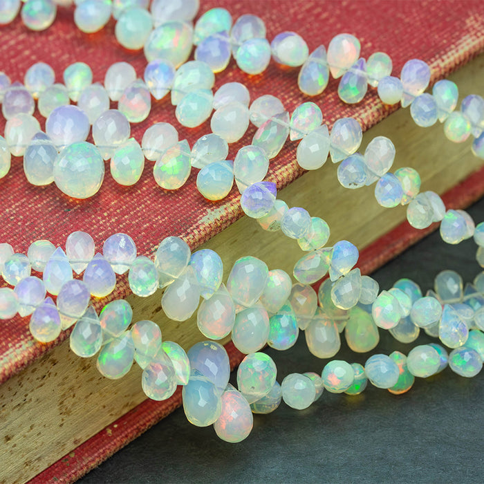 White Ethiopian Opal 3x5-7x10mm Graduated Faceted Drop - 15-16 Inch