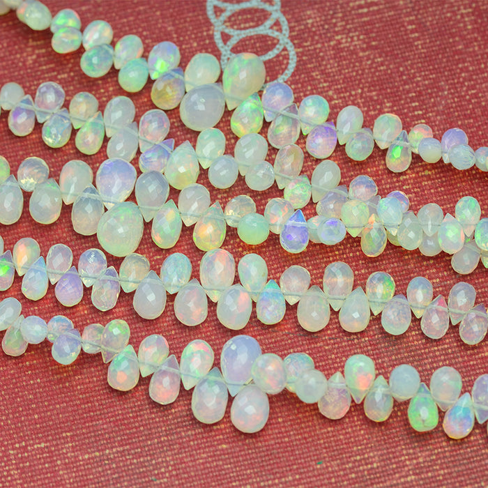 White Ethiopian Opal 3x5-7x10mm Graduated Faceted Drop - 15-16 Inch