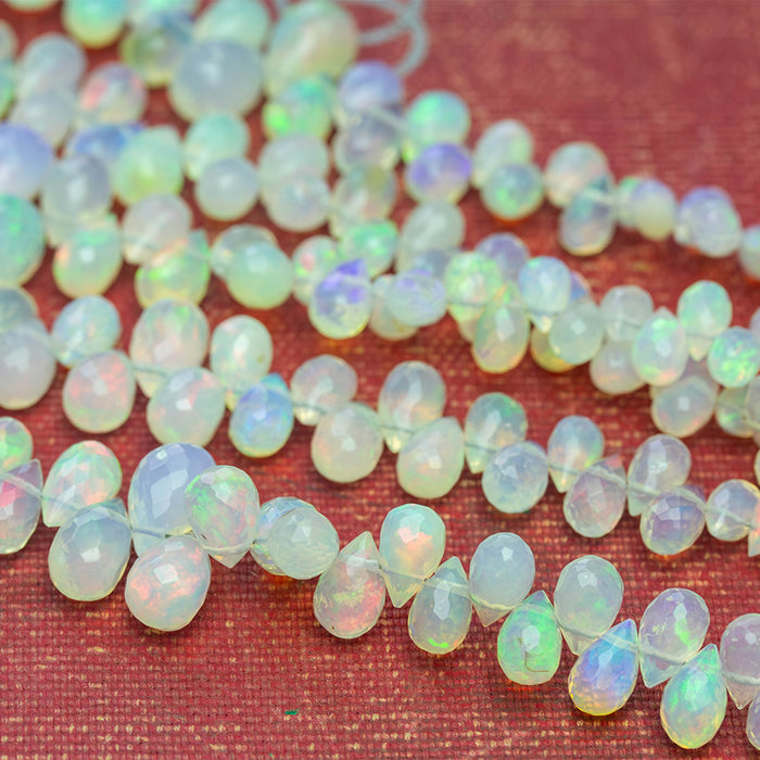 White Ethiopian Opal 3x5-7x10mm Graduated Faceted Drop - 15-16 Inch