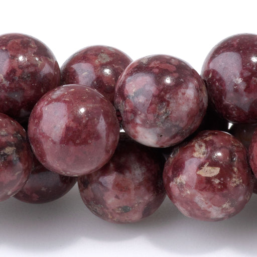 This is a Dakota Stones 10mm Eudialyte Gemstone strand with round beads in 15-16 inch strand.