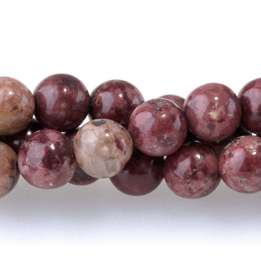 This is a Dakota Stones 6mm Eudialyte Gemstone strand with round beads in 15-16 inch strand.