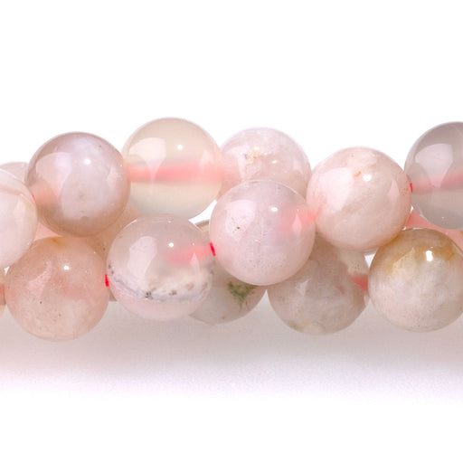 This is a Dakota Stones 6mm Flower Agate Gemstone strand with round beads in 15-16 inch strand.