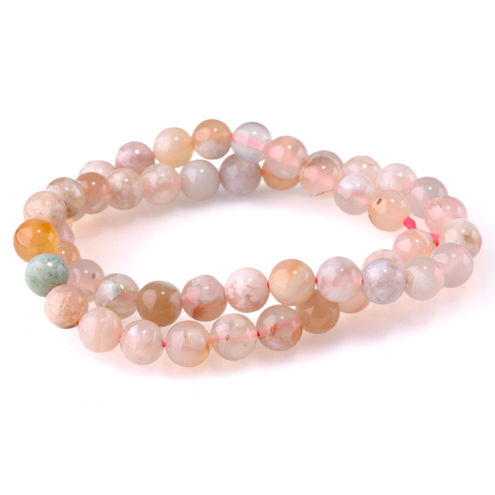 This is a Dakota Stones 8mm Flower Agate Gemstone strand with round beads in 15-16 inch strand.
