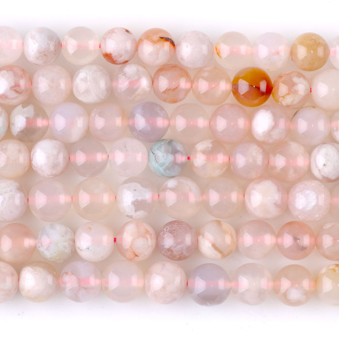 This is a Dakota Stones 8mm Flower Agate Gemstone strand with round beads in 15-16 inch strand.