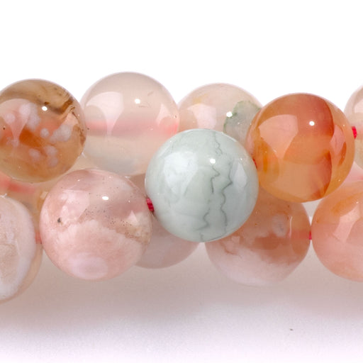 This is a Dakota Stones 8mm Flower Agate Gemstone strand with round beads in 15-16 inch strand.