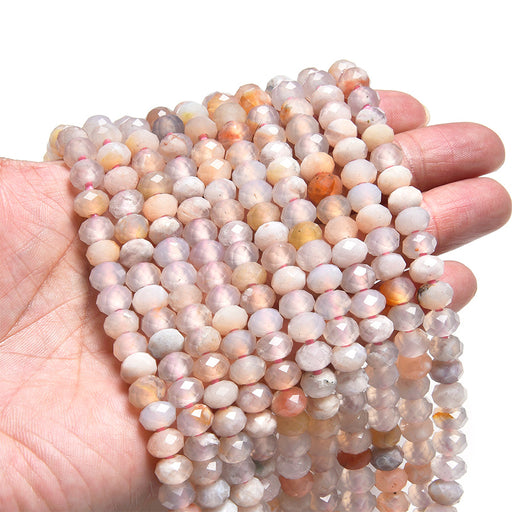 This is a Dakota Stones 5x8mm Flower Agate Large Hole Gemstone strand with faceted rondelle beads in 8 inch strand.