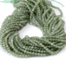 This is a Dakota Stones 4mm Green Apatite Gemstone strand with faceted round beads in 15-16 inch strand.