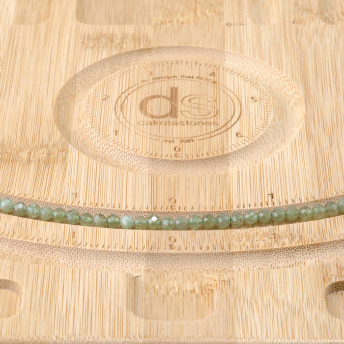 This is a Dakota Stones 4mm Green Apatite Gemstone strand with faceted round beads in 15-16 inch strand.