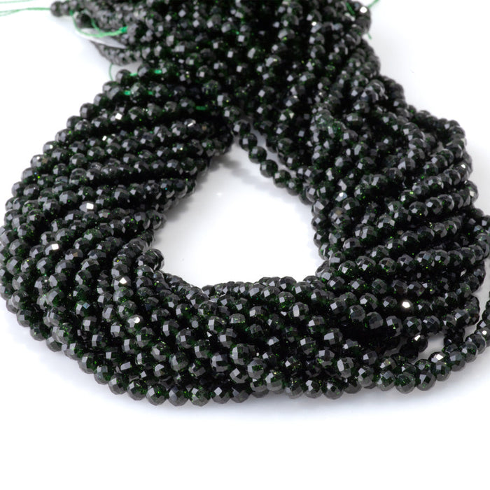 This is a Dakota Stones 4mm Green Goldstone Microfaceted Gemstone strand with round beads in 15-16 inch strand.