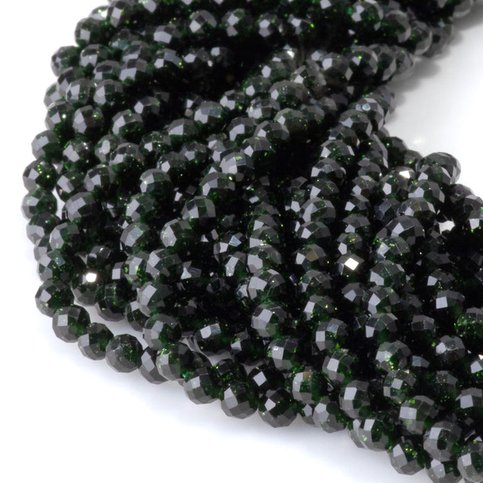This is a Dakota Stones 4mm Green Goldstone Microfaceted Gemstone strand with round beads in 15-16 inch strand.