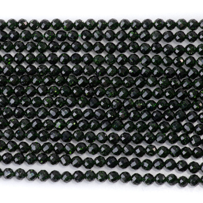 This is a Dakota Stones 4mm Green Goldstone Microfaceted Gemstone strand with round beads in 15-16 inch strand.