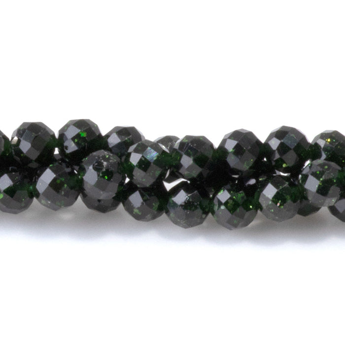 This is a Dakota Stones 4mm Green Goldstone Microfaceted Gemstone strand with round beads in 15-16 inch strand.