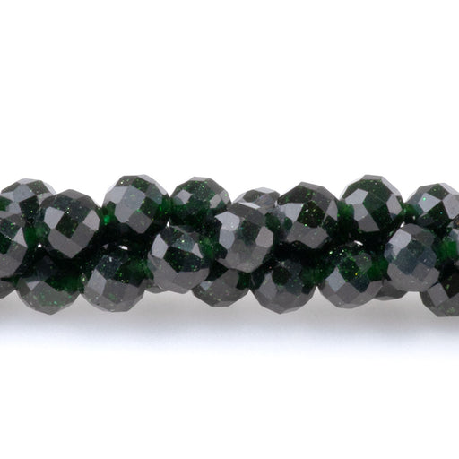 This is a Dakota Stones 4mm Green Goldstone Microfaceted Gemstone strand with round beads in 15-16 inch strand.