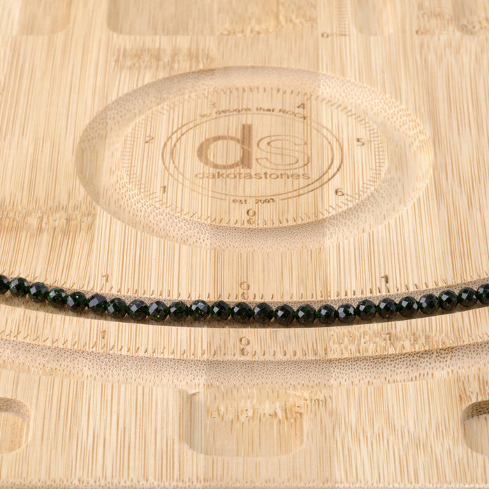This is a Dakota Stones 4mm Green Goldstone Microfaceted Gemstone strand with round beads in 15-16 inch strand.
