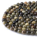 This is a Dakota Stones 10mm Green Garnet Gemstone strand with round beads in 15-16 inch strand.