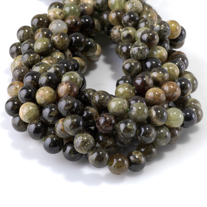 This is a Dakota Stones 10mm Green Garnet Gemstone strand with round beads in 15-16 inch strand.
