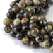 This is a Dakota Stones 10mm Green Garnet Gemstone strand with round beads in 15-16 inch strand.